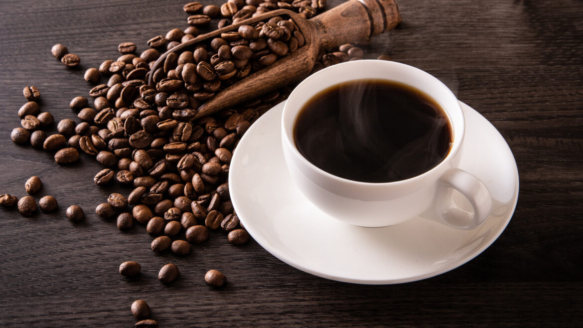 Coffee,Beans,And,Hot,Coffee,On,The,Table